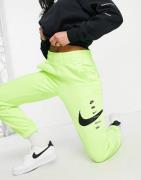 Nike - Grønne joggingbukser med 'swoosh'-logo