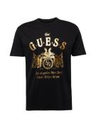 GUESS Bluser & t-shirts  guld / sort