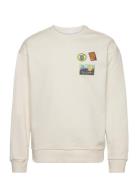 Loose Fit Crew Sweat With Badge Emb Tops Sweatshirts & Hoodies Sweatshirts Cream Knowledge Cotton Apparel
