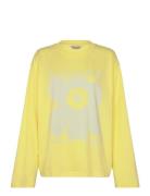 Reunat Unikko Placement Tops T-shirts & Tops Long-sleeved Yellow Marimekko